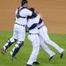 Detroit Tigers' catcher Gerald Laird and Jhonny Peralta swarm pitcher Phil Coke after beating the Yankees 8-1 during Game 4 of the ALCS and advancing to the World Series at Comerica Park in Detroit on Thursday night.